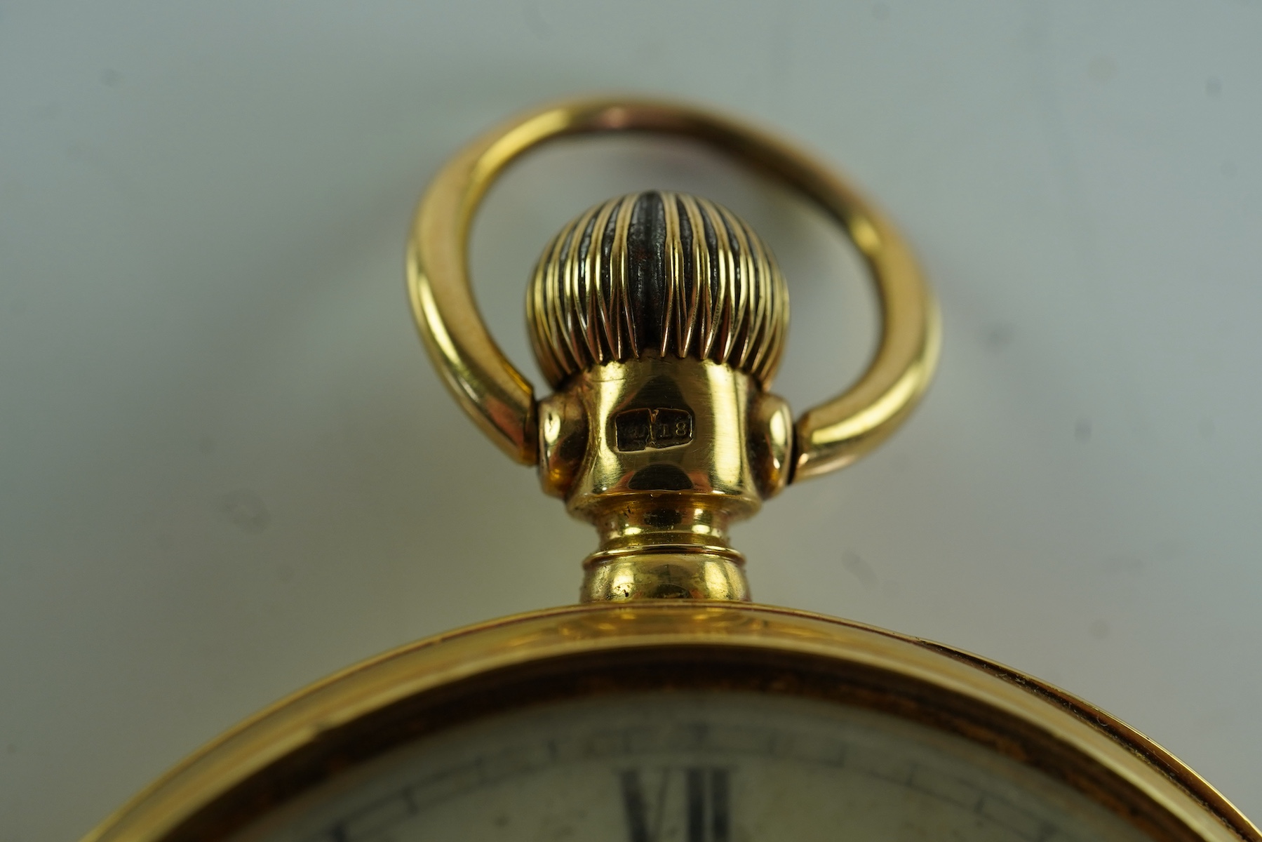 A late Victorian engine turned 18ct gold open faced keyless pocket watch by The American Waltham Watch Company